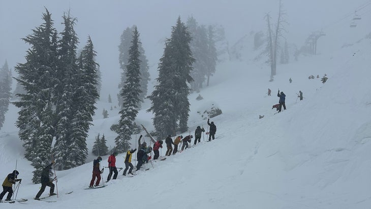 Rescuers probe for survivors at Palisades Tahoe. 