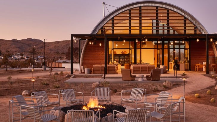 Cool desert nights are balanced by time around a fire pit in front of the AutoCamp Joshua Tree’s main lodge building.
