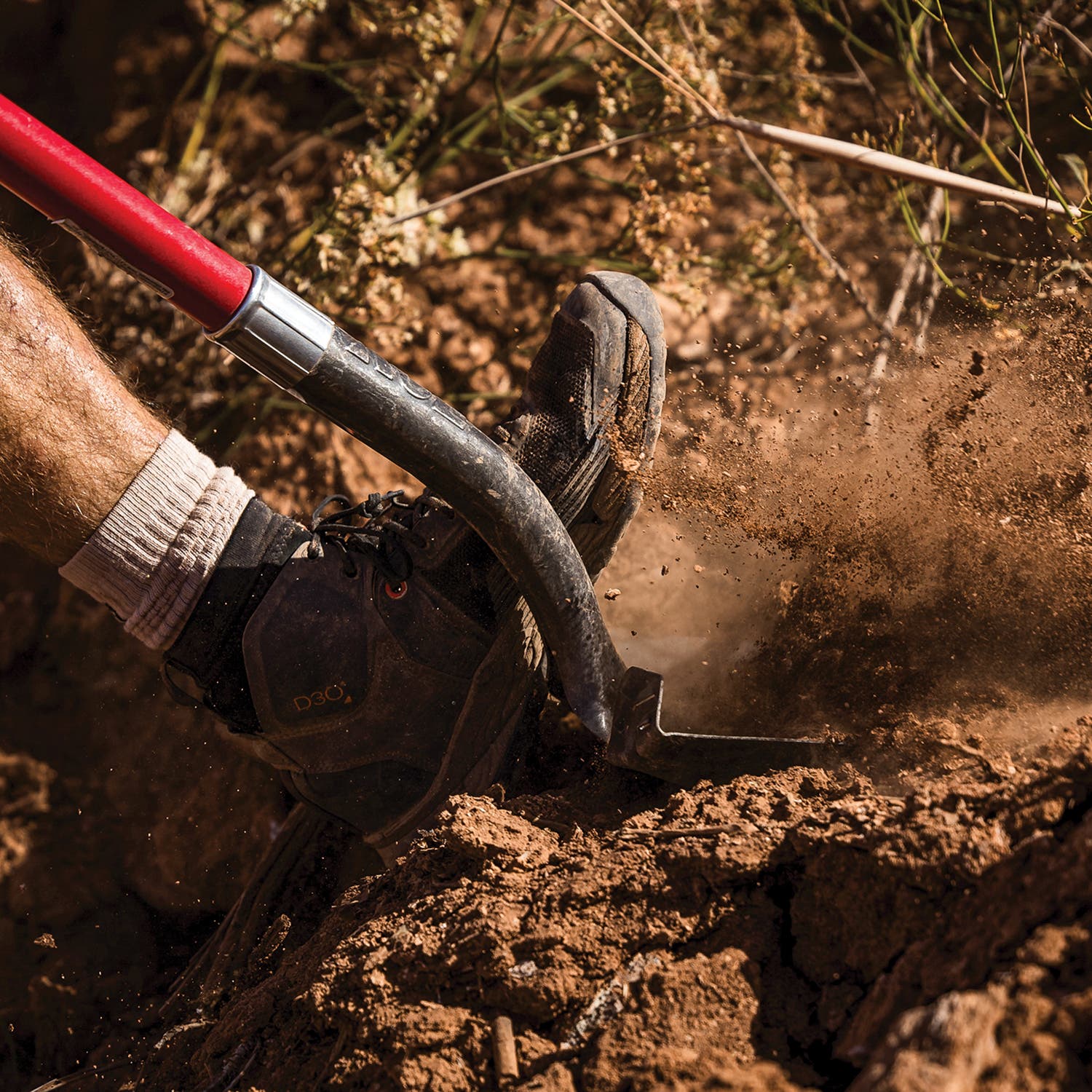 Rampage participant digging a line