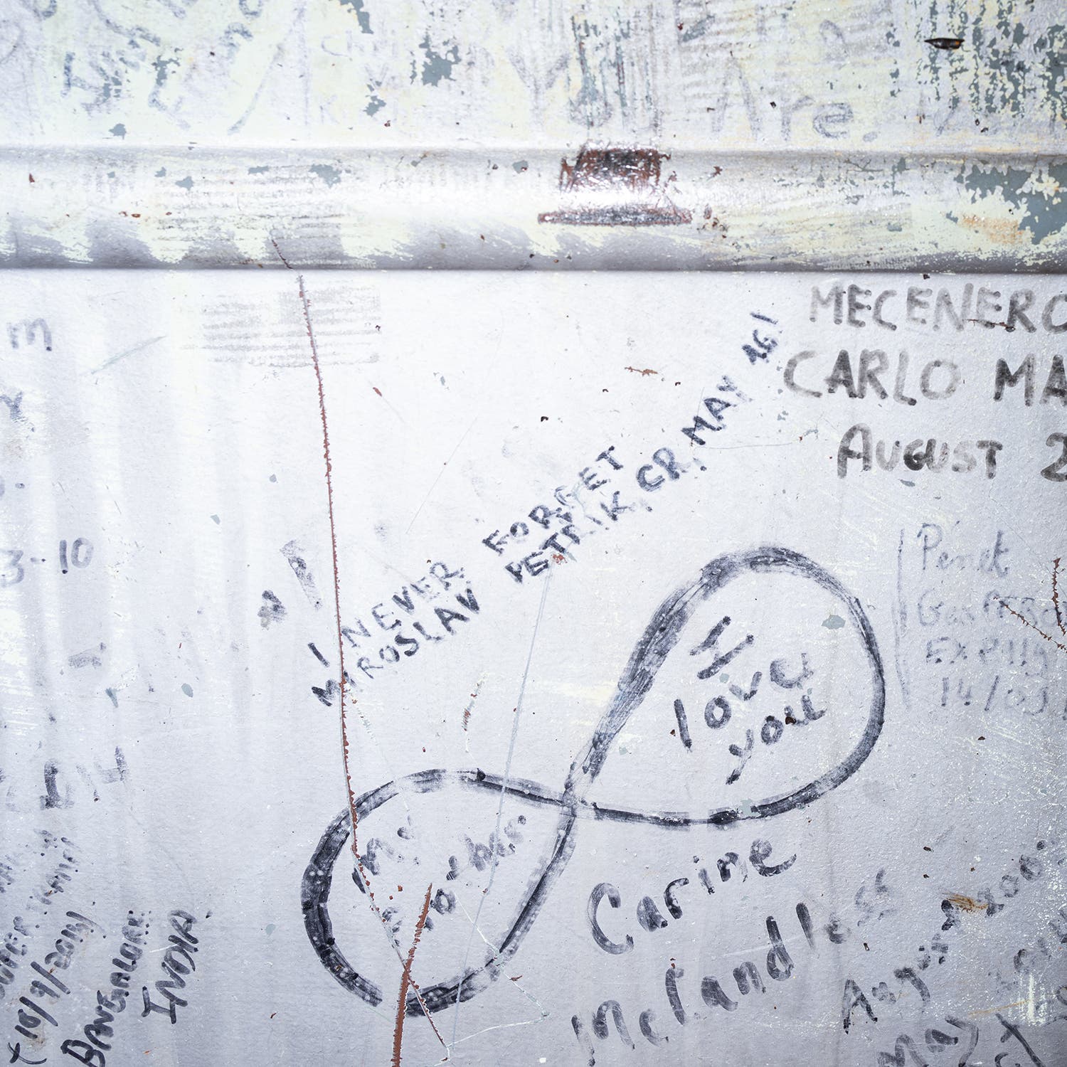 Graffiti covers the walls and exterior of Bus 142