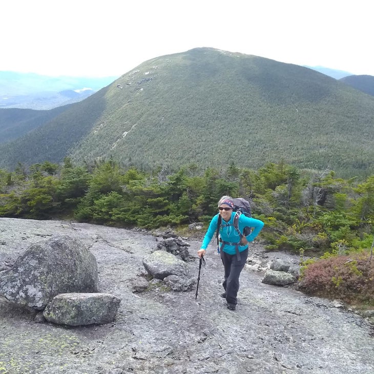 Woman hikes up Mount Marcy, the Adirondacks