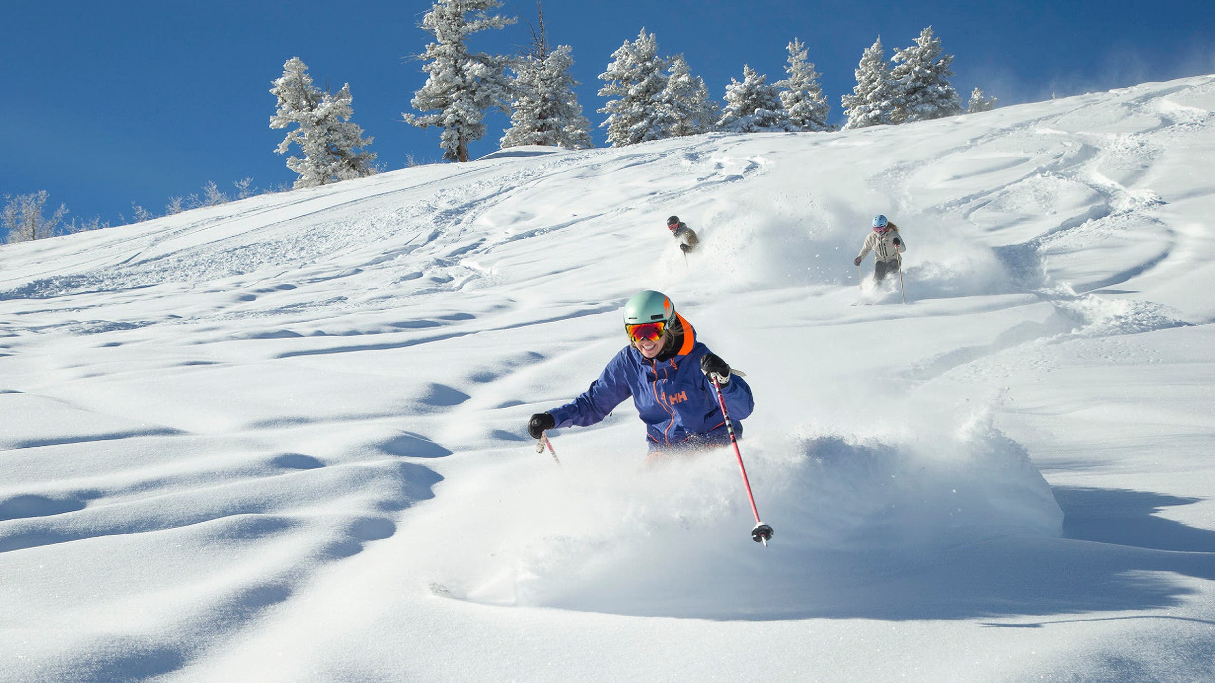 skiers on a powder day at Buttermilk, in Aspen, Colorado