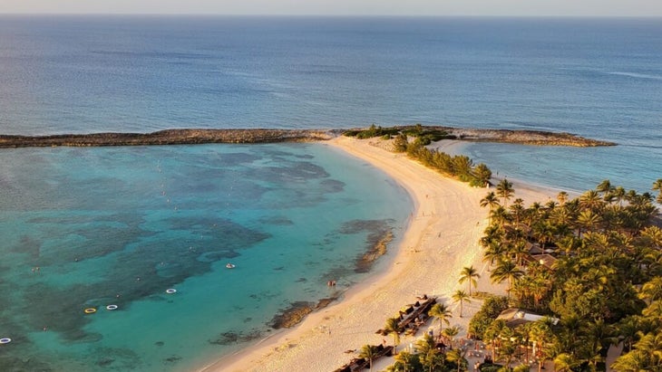 A crescent of golden sand in Nassau, set against the turquoise Caribbean Sea, is an idyllic part of vacationing in the Bahamas.