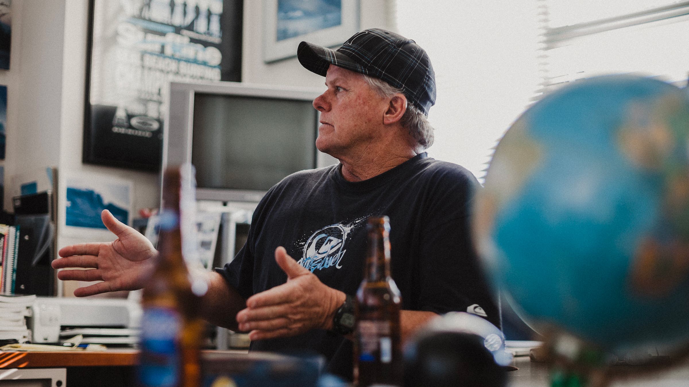 The late Sean Collins, Surfline’s original chief forecaster, at his desk