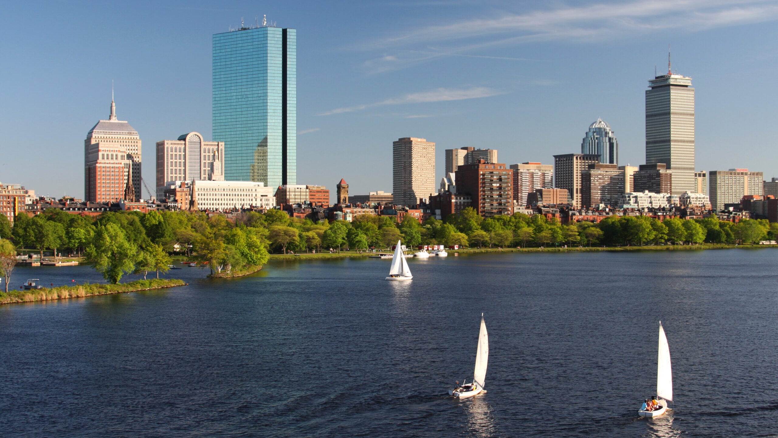 Sailing on the Charles River with Boston's Back Bay skyline in the background.