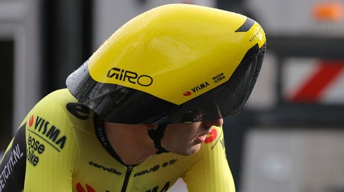 A pro cyclist wears a crazy helmet.
