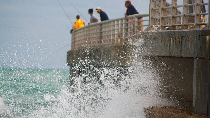 people fishing on Sebastian Inlet State Park, Florida's pier at one of the best east coast beaches