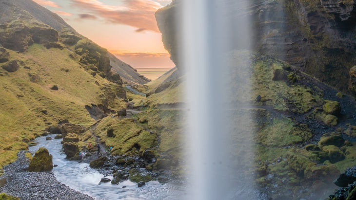Golden hour in the cave behind Seljalandsfoss waterfall