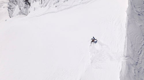 The line involved boot-packing and skiing narrow 45-to-50 degree slopes. In this image, Lusti makes a sweeping turn.