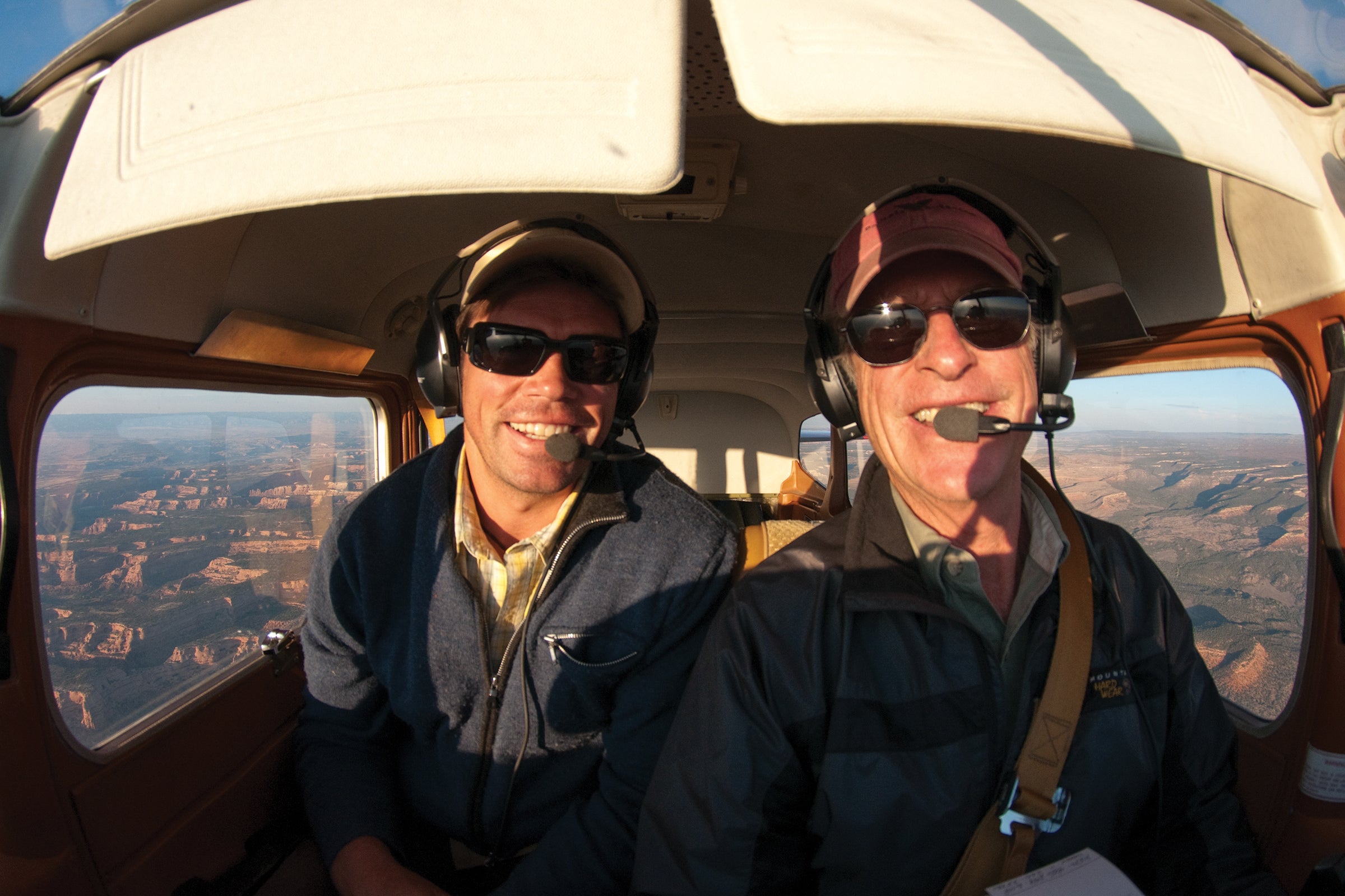 The author (left) and his father, John McBride, in the air over Utah