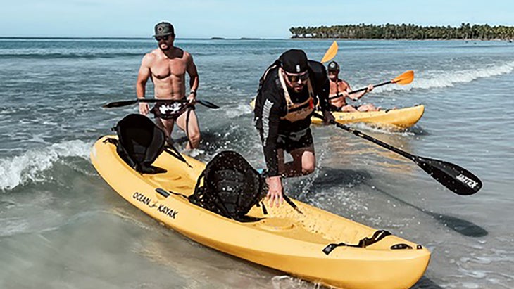 Mark Wahlberg and Mikael Lindnord practice kayaking for adventure racing film