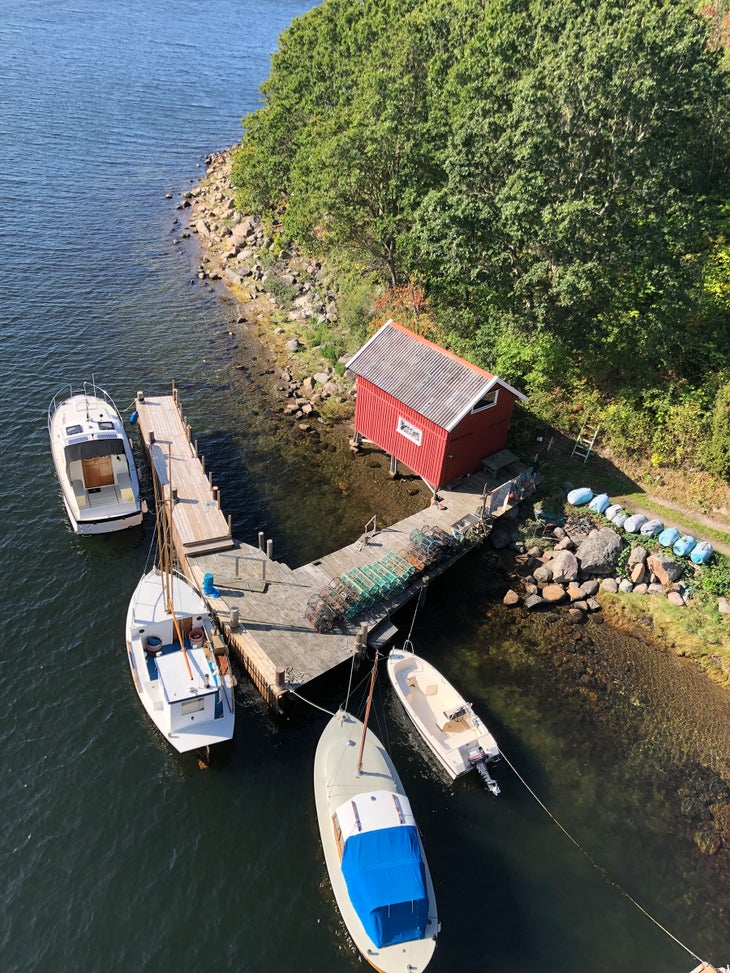 boats and a red house in sweden
