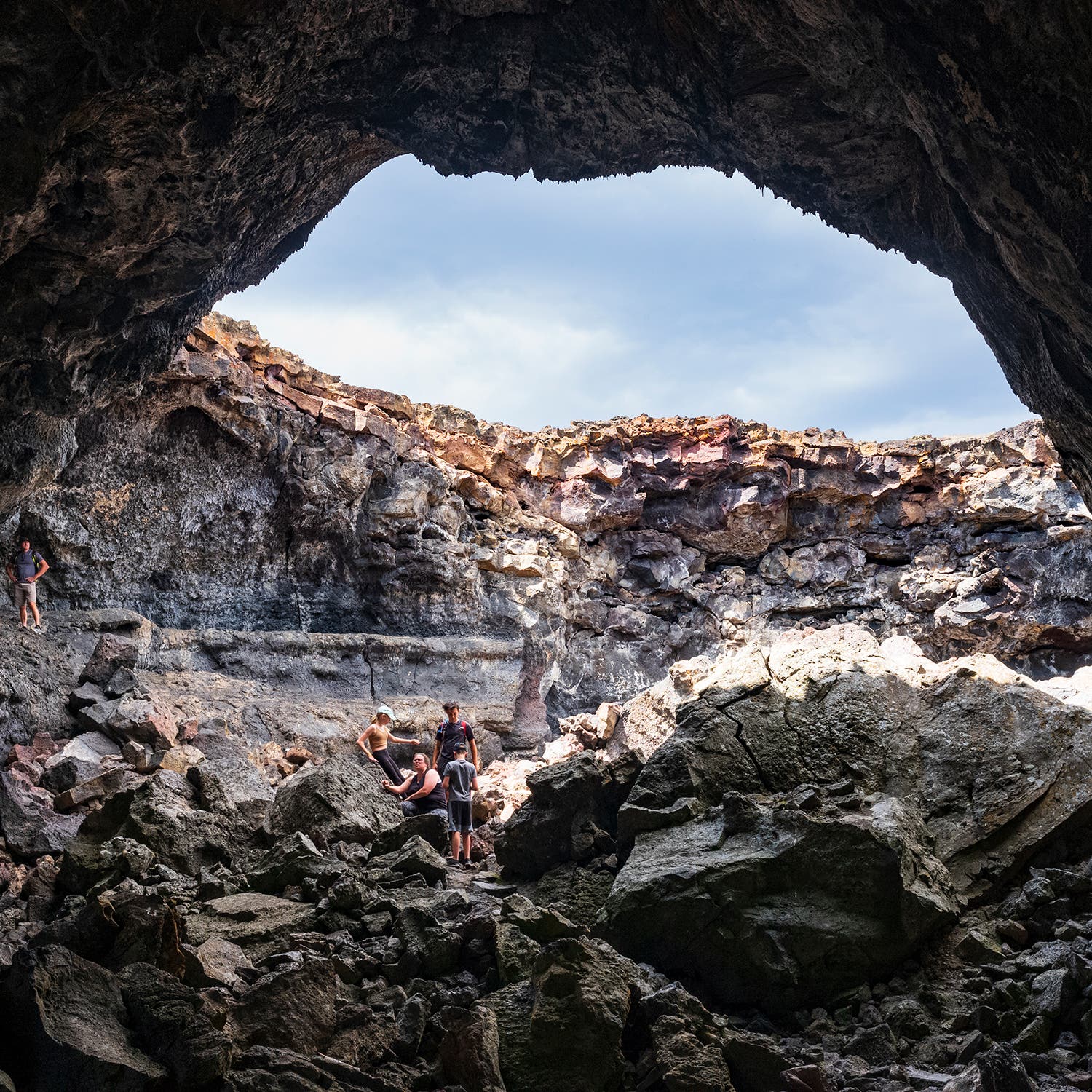 A group of visitors exploring Craters’ Indian Tunnel
