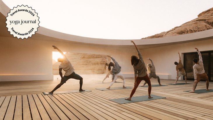 A group doing yoga in the desert