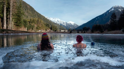 Cold plungers sit in the freshwater pond “The Oasis” looking out to the Bedwell Valley, which is home to the Clayoquot Wilderness Lodge. (Photo: Yasmin Käppeler)  