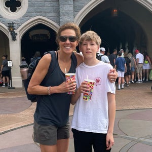 mother and son sporting outdoor gear at a Disney park