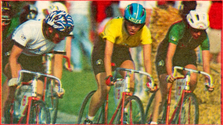 Three cyclists race during the women’s Little 500. One wears a helmet that says "Willkie.”