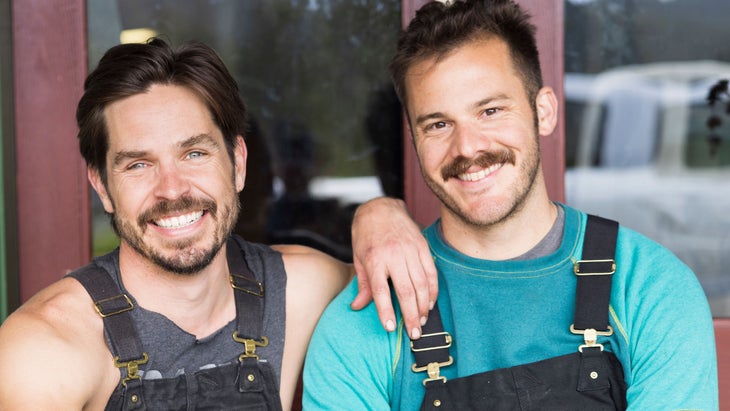 Spencer Scott and partner, Earth Day. Two men wearing overalls