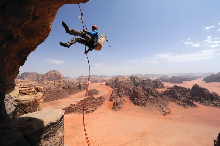 A climber repelling in Wadi Rum.