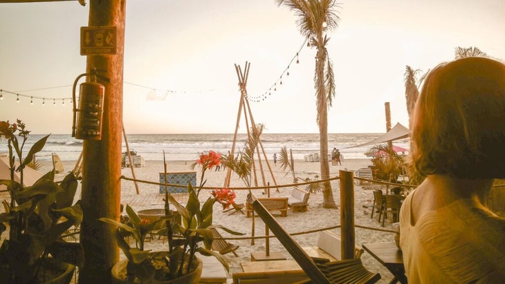 The beachfront scene at La Tuna in Cerritos Beach is a mix of happy hour and golden hour.