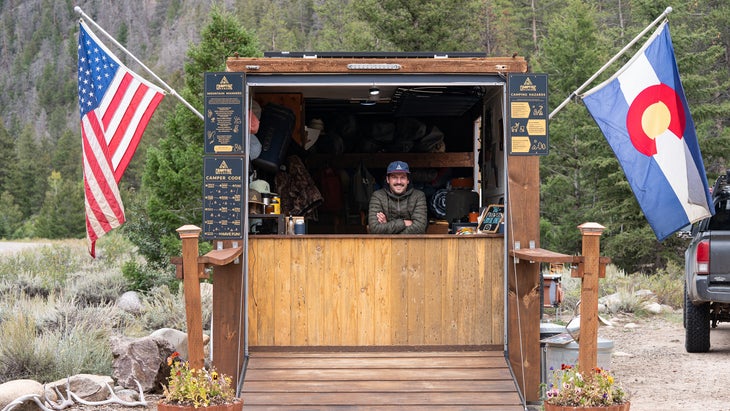 Campfire Ranch Founder Sam Degenhard, in his camp hut that offers free firewood and rental tents, stoves, and other gear if you need it