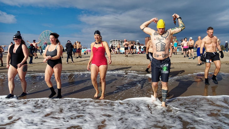 people on Coney Island getting ready to cold plunge
