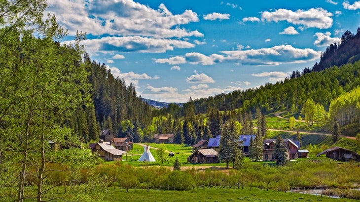 Dunton Hot Springs in summer is a joy to behold, surrounded by soft green and hillsides ready for roaming.