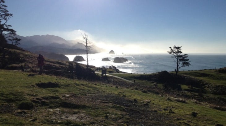 The sun shines over the Pacific on the coast of Ecola State Park, Oregon.