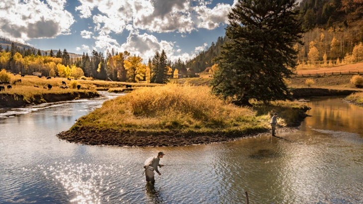 Two men try their luck fly-fishing in the West Fork of the Dolores River, Colorado.