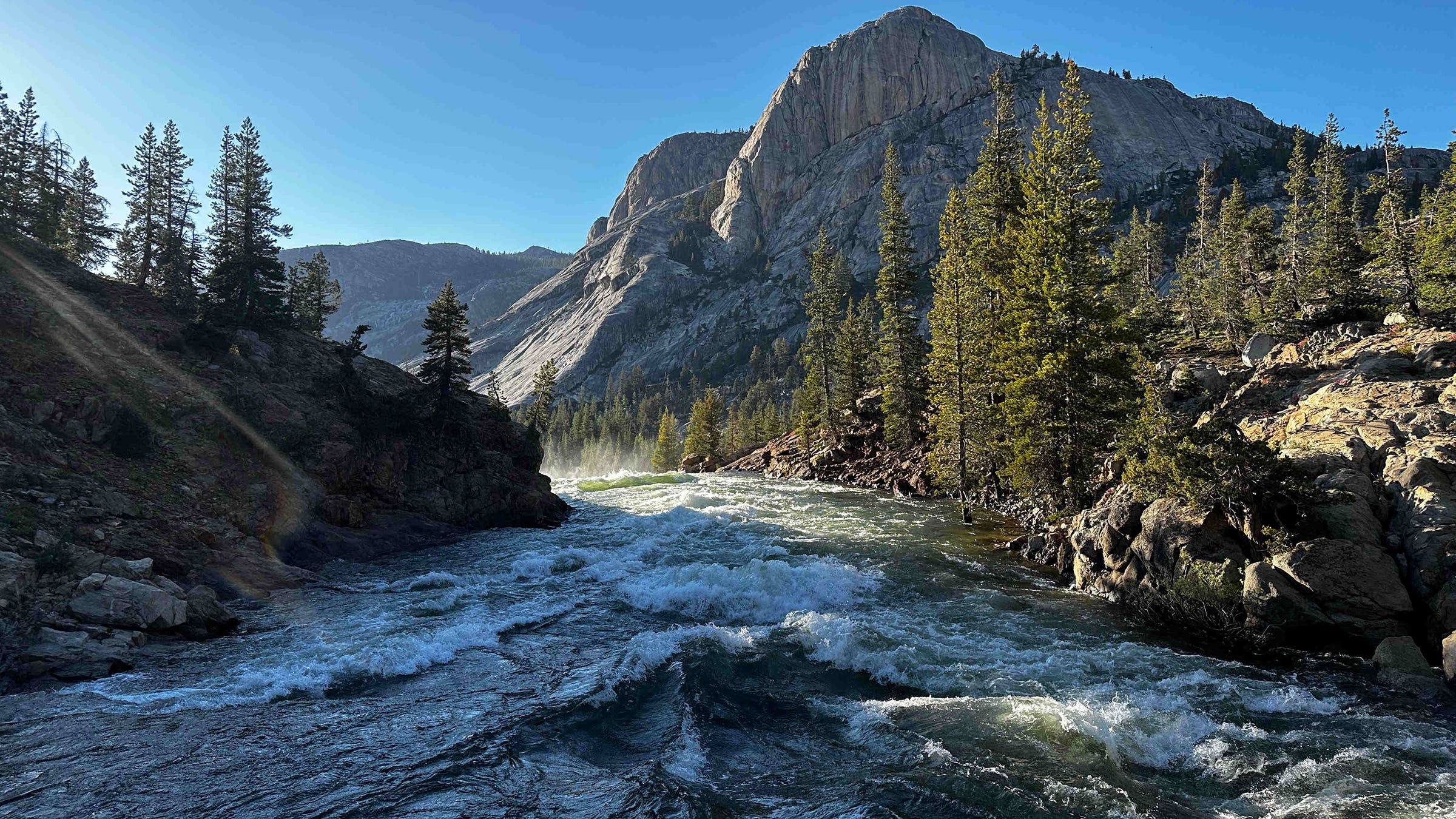 The Tuolumne River raging downstream of White Cascade. The northern approach to the bridge was underwater.