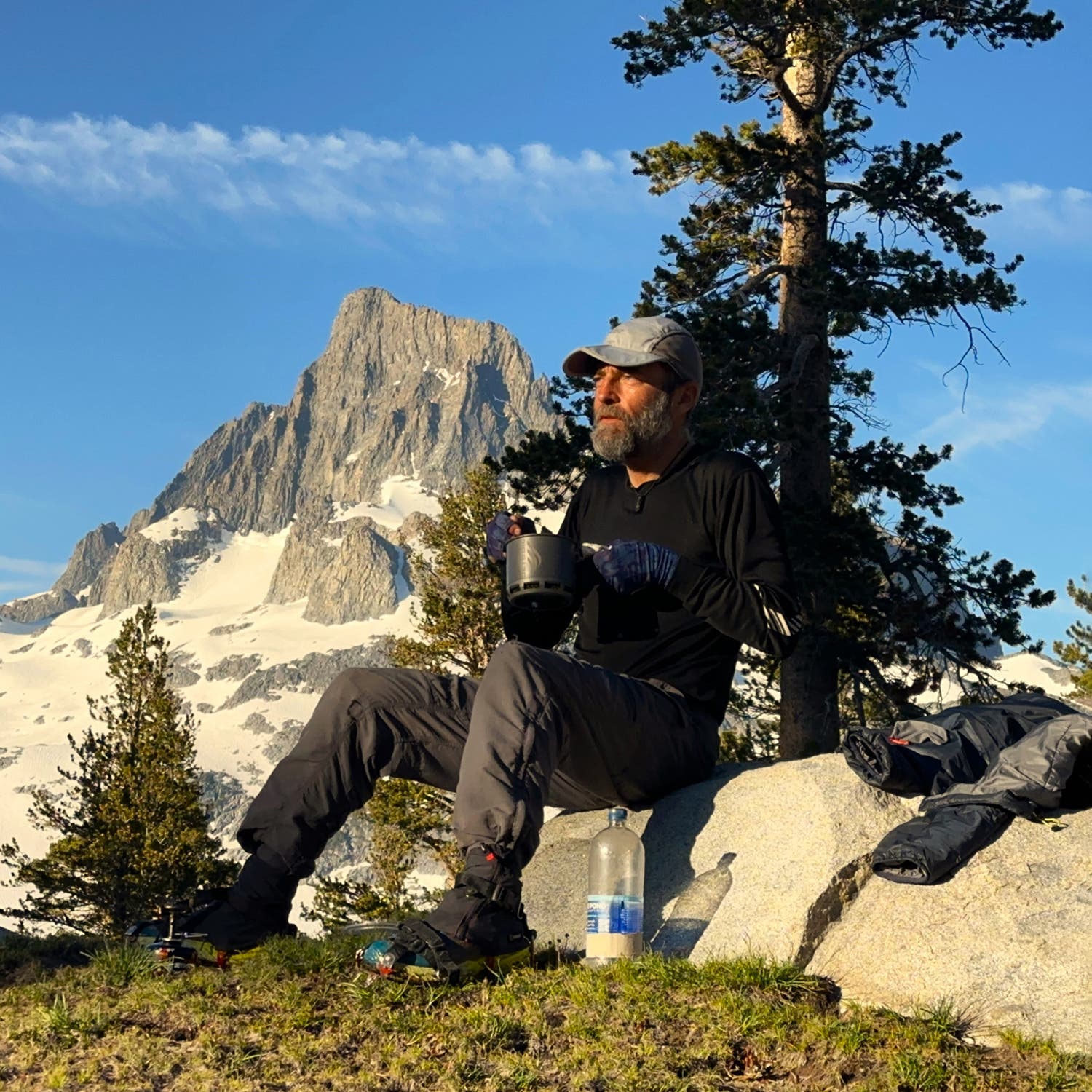 The author enjoys breakfast in the sun after an alpine start to beat the sun cups before they turned to mush over Island Pass.