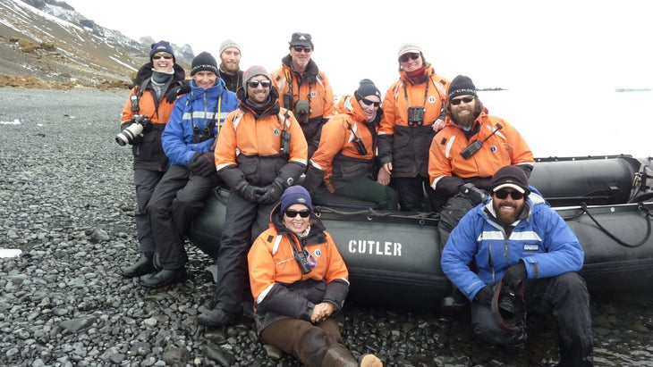 group of polar guides waits for visitors to come ashore