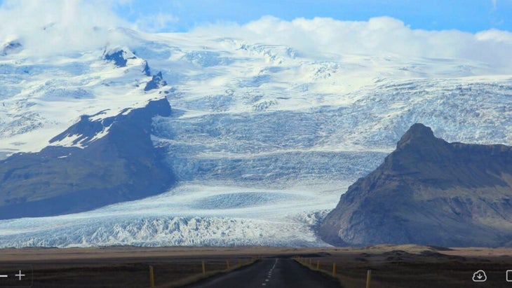 The Ring Road approaching a massive glacier in Iceland
