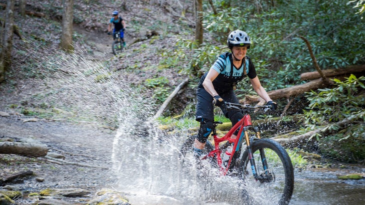 woman on mountain bike crossing a river at Mulberry Gap, Georgia