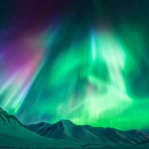 Strong geomagnetic Aurora Borealis (Northern Lights) above Alaskan mountains, Atigun Pass - Dalton highway (North of Fairbanks), Alaska, USA.