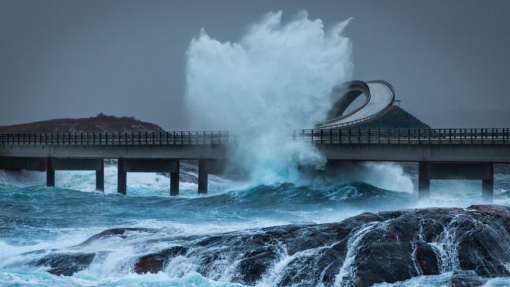 A wave crashes up against the Atlantic Road on Norway's west coast.