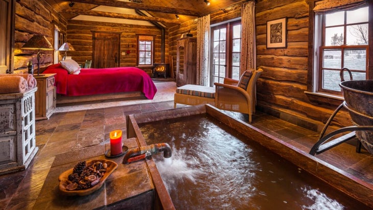 An in-room hot spring is the attraction at Dunton’s Well House Cabin. 