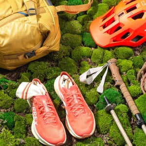 Closeup of 2024 Outside Summer Gear Guide products on mossy background
