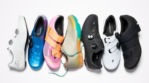Various cycling shoes displayed on white background