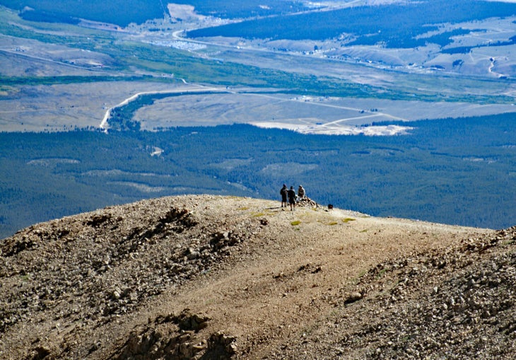Hikers on shoulder of mountain