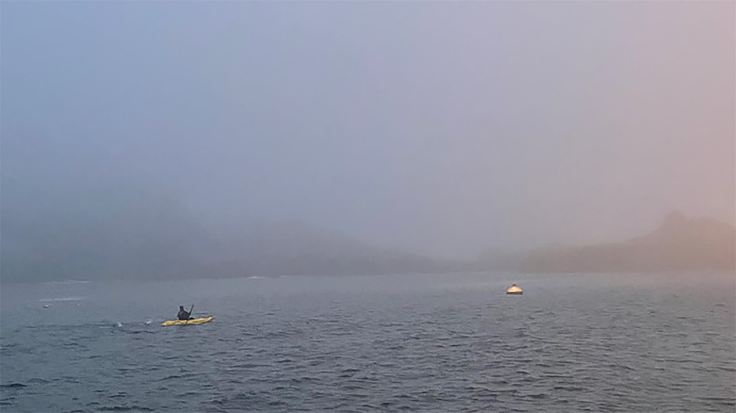 A swimmer and kayaker reach the Farallon Islands. 