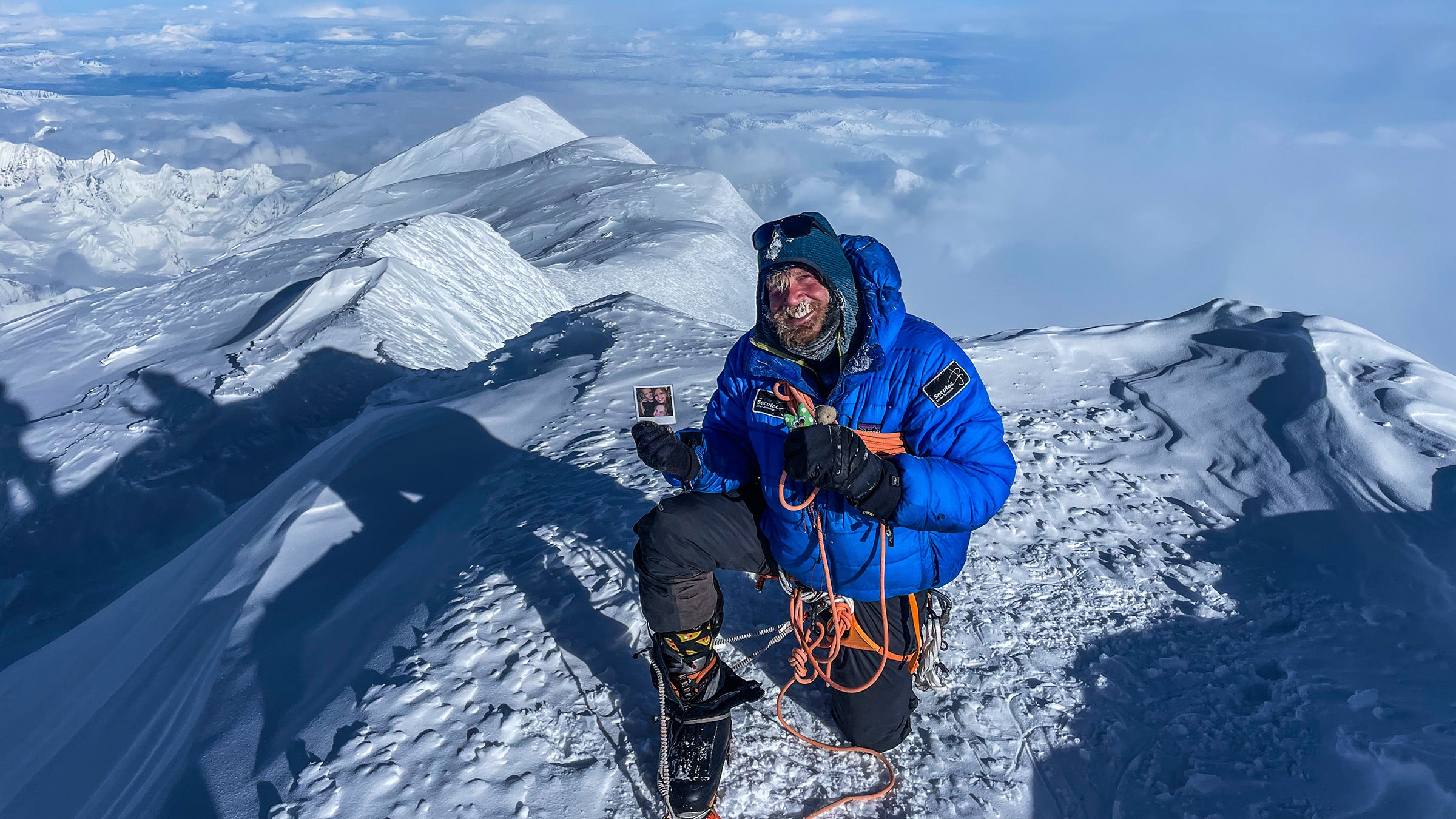 A belgian climber ascends Denali in snow.