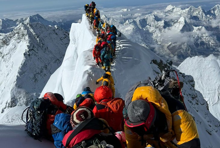 Climbers standing on Mount Everest.