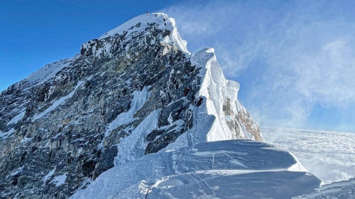 Mount Everest's summit is blown by high winds.