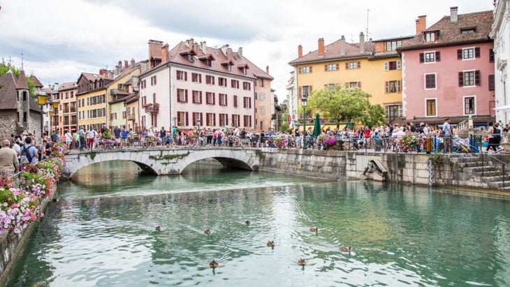 A canal cuts through the town of Annecy, known as the Venice of France.