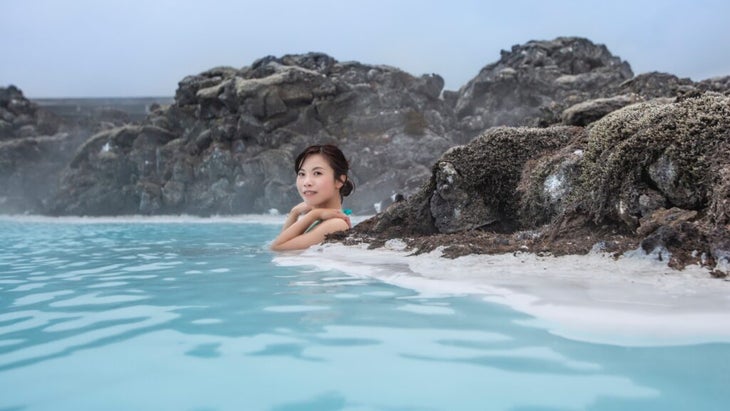 A woman soaks in Iceland’s Blue Lagoon. 