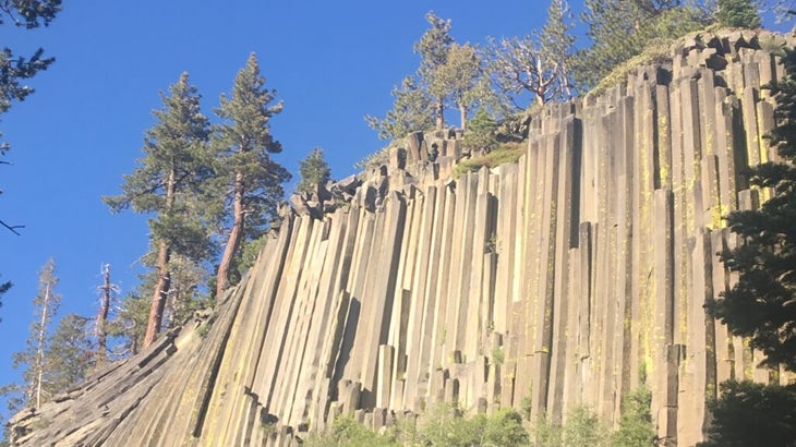 Looking up at the singular basalt formations of Devils Postpile, California