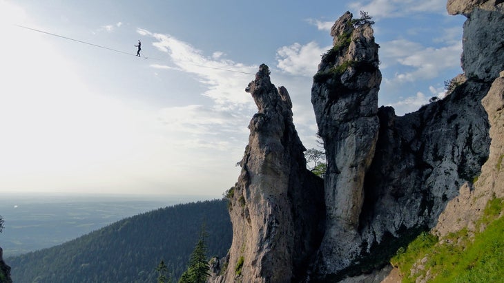 woman highlining high in the air