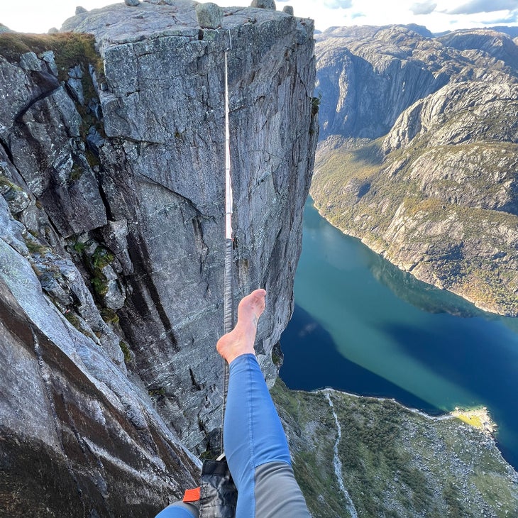 person taking first step in highlining