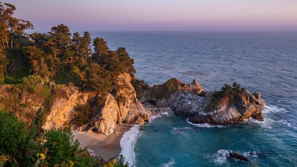 Spectacular scenery at Julia Pfeiffer Burnes State Park—a turquoise cove of the Pacific, cliffs, and an 80-foot-high waterfall—on the Big Sur coast makes this an incredibly popular camping destination.